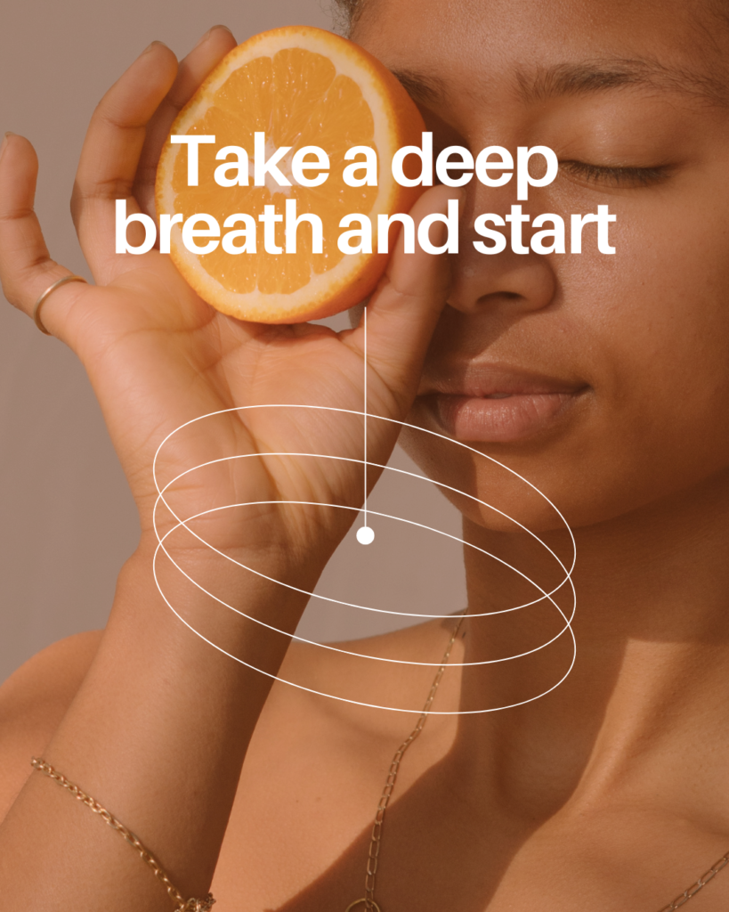 A woman holding a half of an orange to her left eye while closing both of her eyes with a caption text over the image saying "Take a deep breath and start"